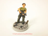 Painted miniature female soldier in a post apocalyptic zombie world 25mm scale figure.